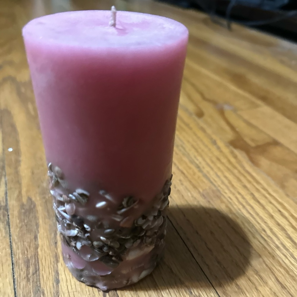 Beautiful new not used pink candle with embedded beautiful sea shells
